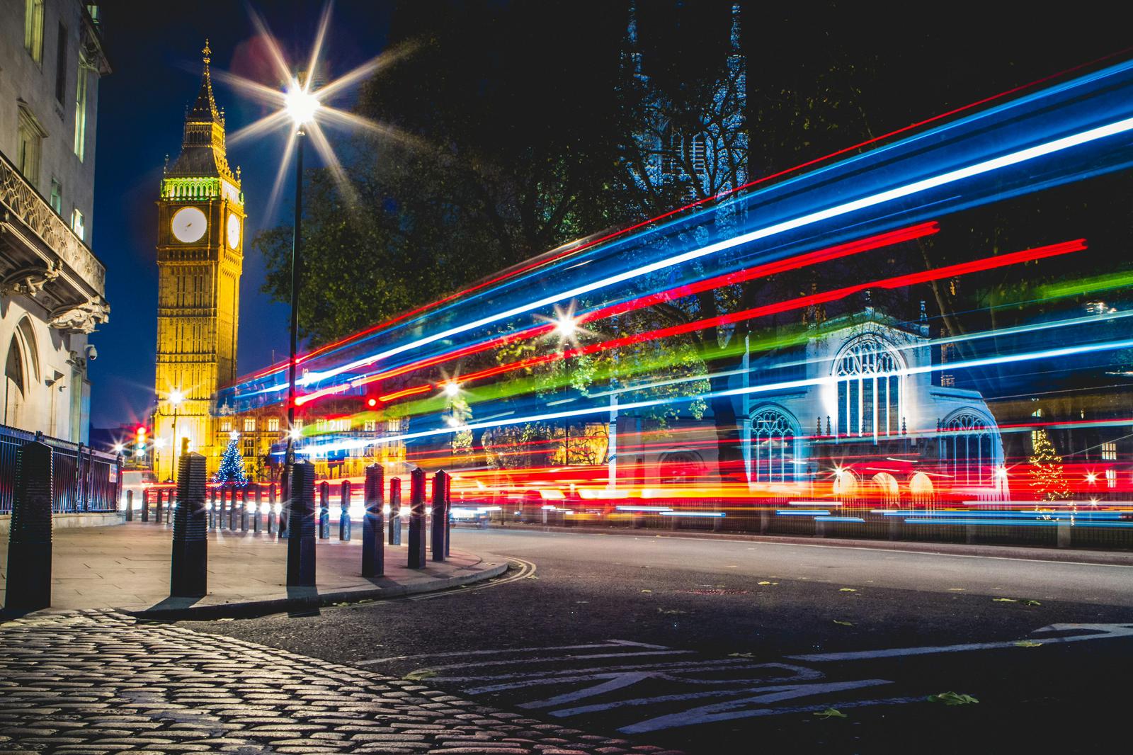 Big Ben and a London street with light trails at night
